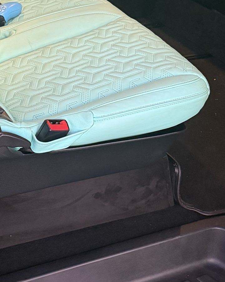 Quilted turquoise leather seat detail