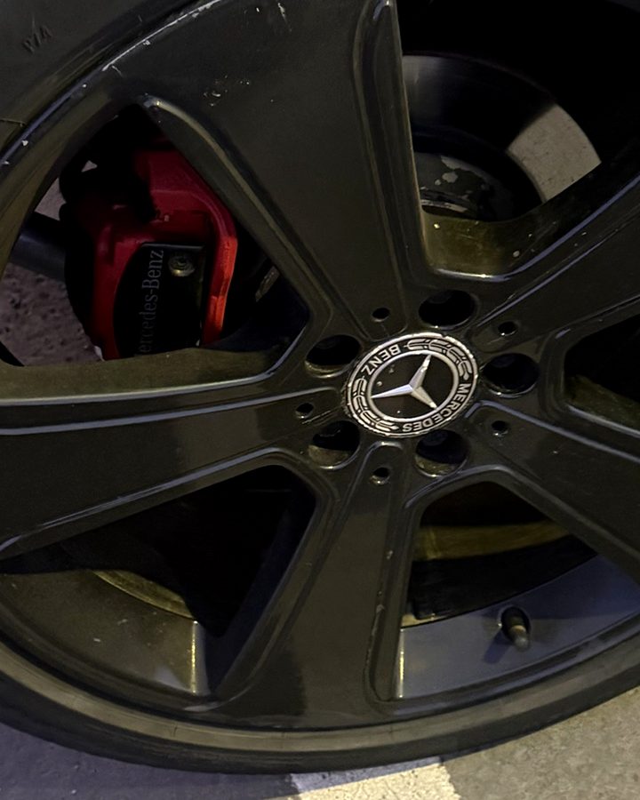Black alloy wheel with red Mercedes-Benz brake caliper