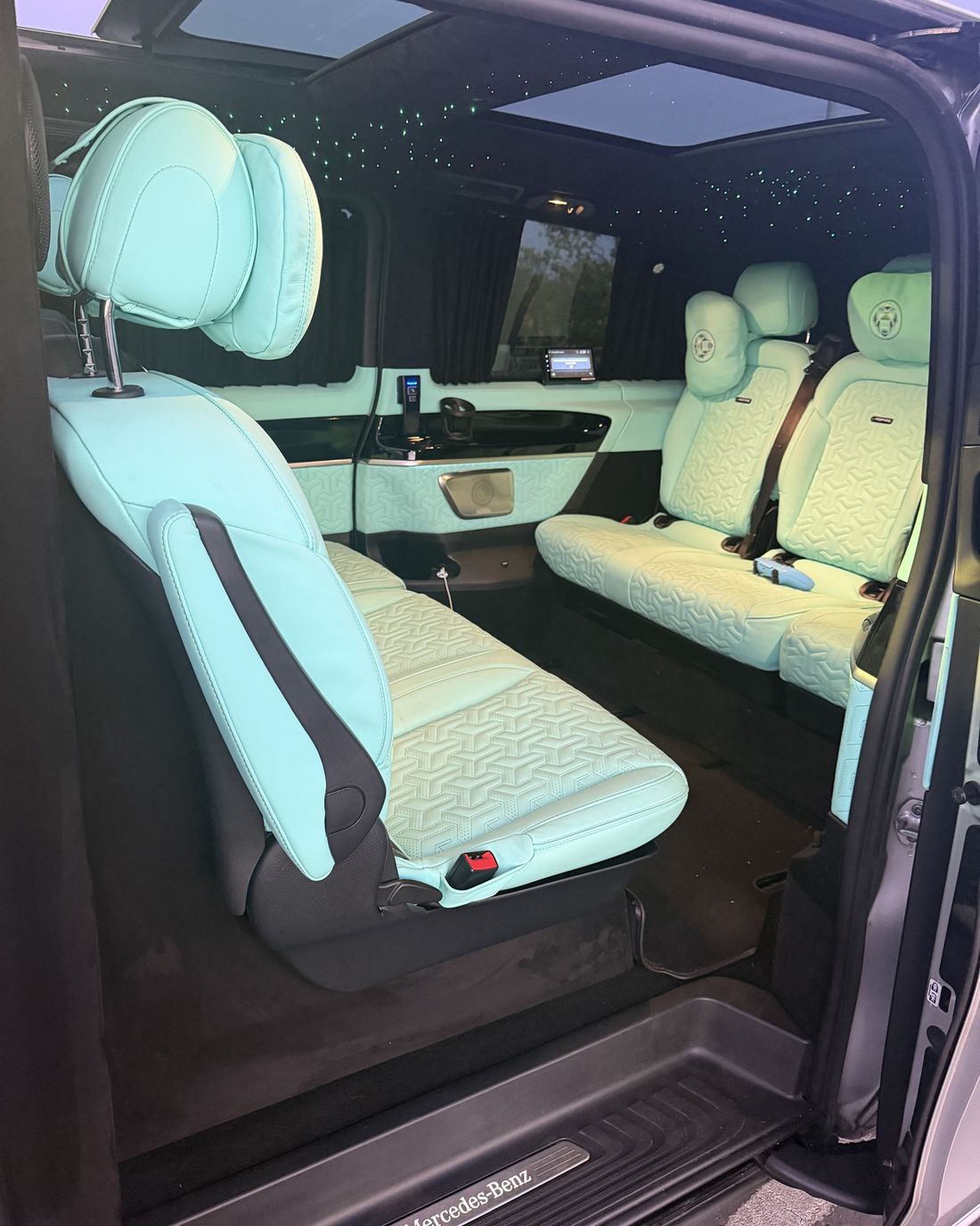 Turquoise leather interior seen through the open sliding door