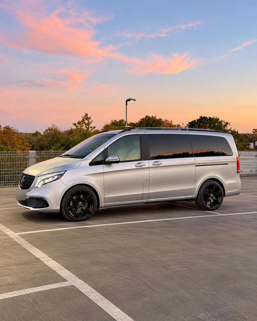 Side view of the V-Class under a sunset sky
